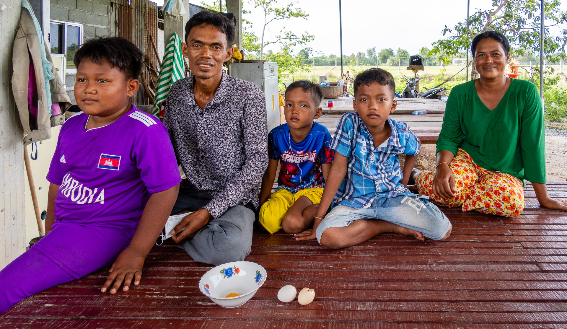 Family outside their house in Cambodia